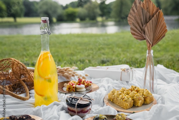 Fototapeta A Sumptuous Spread: Picnic Basket Brimming With Delicious Fare