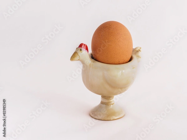 Obraz An egg on the egg cup with white background
