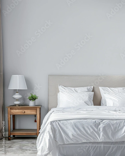Fototapeta Modern hotel room with elegant bedding and stylish decor. Neutral tones and use of natural light.