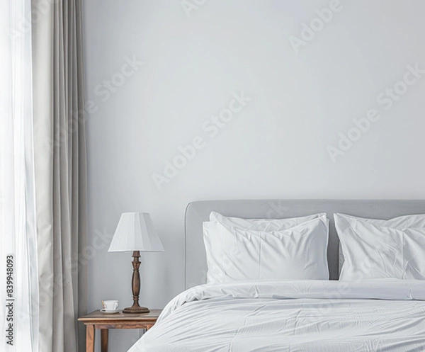 Fototapeta Modern hotel room with elegant bedding and stylish decor. Neutral tones and use of natural light.