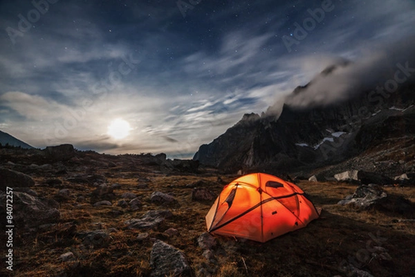 Fototapeta Orange tent in the mountains.