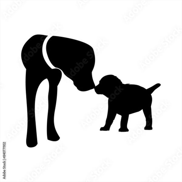 Fototapeta The image is a black and white silhouette of a dog and a puppy kissing.
The dog is larger than the puppy and appears to be bending down to meet the puppy’s snout.
Their tails are wagging.