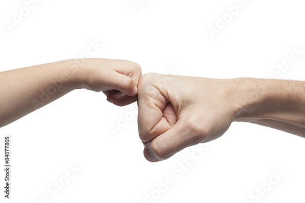 Fototapeta father and son punching fists on white background