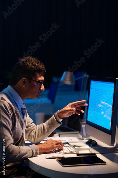 Fototapeta Pointing at computer monitor