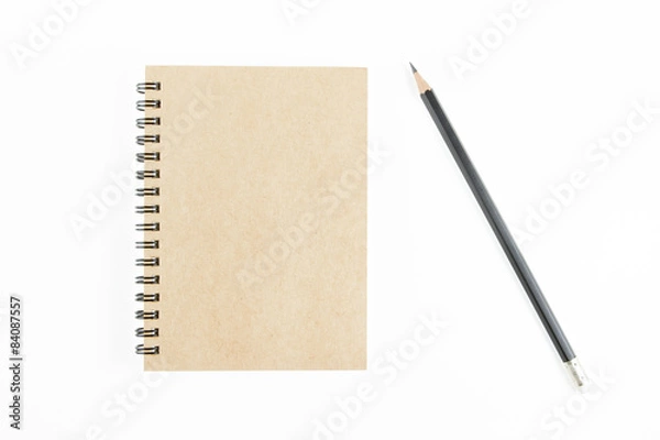 Fototapeta Brown notepad  and pencil on isolated white