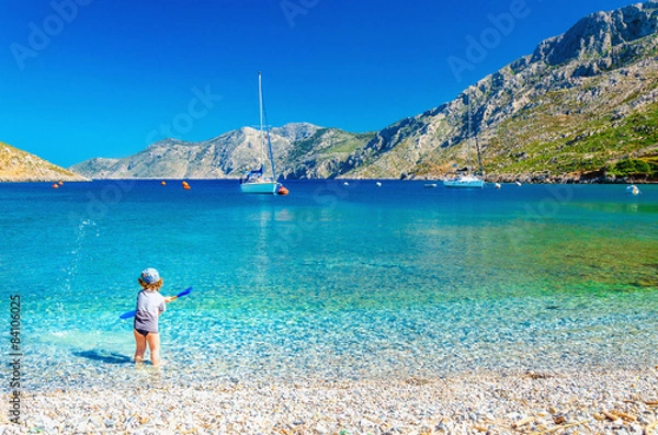 Fototapeta Sea bay on Greek Island with small boy at play