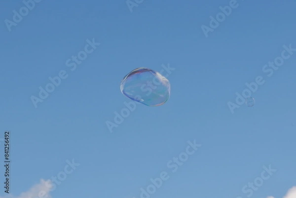 Obraz soap bubbles flying in the cloudy sky