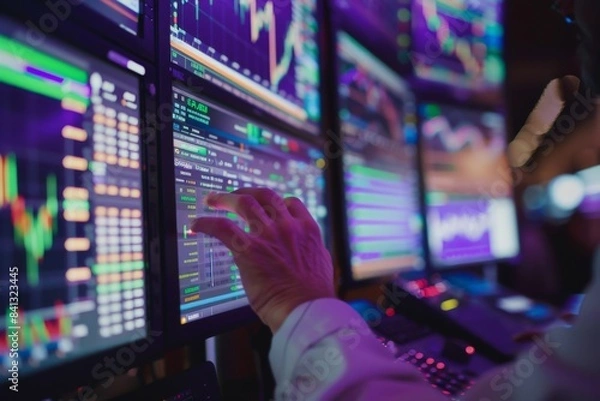 Fototapeta Trader Analyzing Stock Market Data on Screens