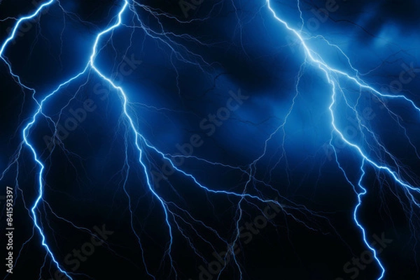 Fototapeta A dramatic blue lightning bolt illuminates the dark night sky during a powerful thunderstorm