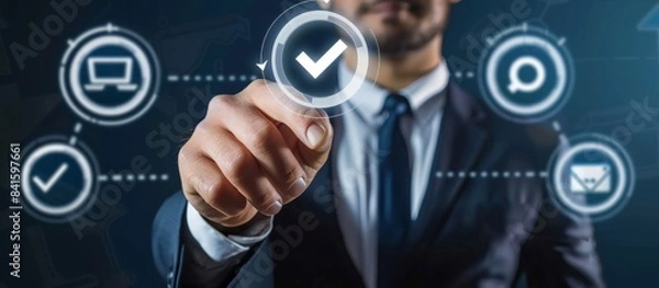Fototapeta In a futuristic virtual setting, a businessman navigates a digital interface, selecting a checkmark to represent success, approval, and innovation, highlighting the usage of modern technology