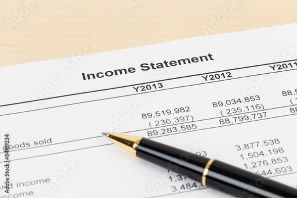 Fototapeta Income statement financial report with pen
