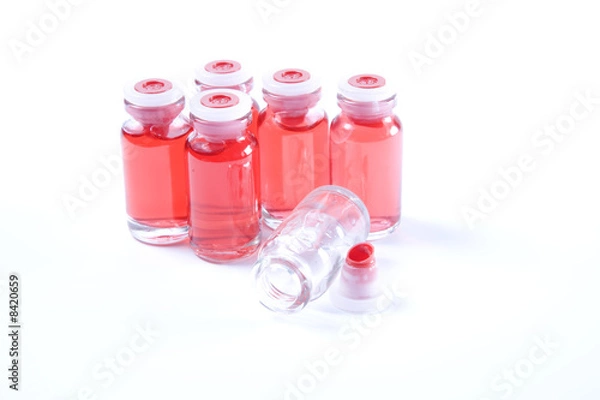Fototapeta Red serum bottles