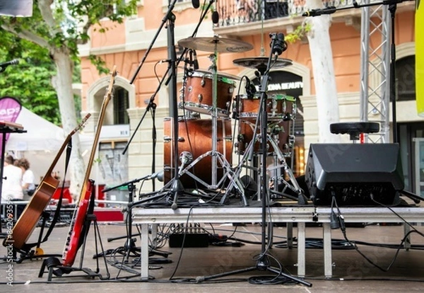 Obraz small concert stage with music instruments and no people at a street festival outdoors in Barcelona
