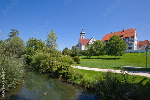 Obraz View from the city garden across the river Schmiech to the convict church.