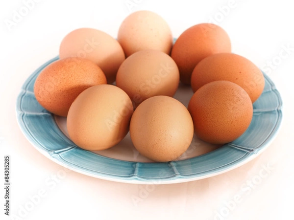 Obraz Dish with eggs on white background
