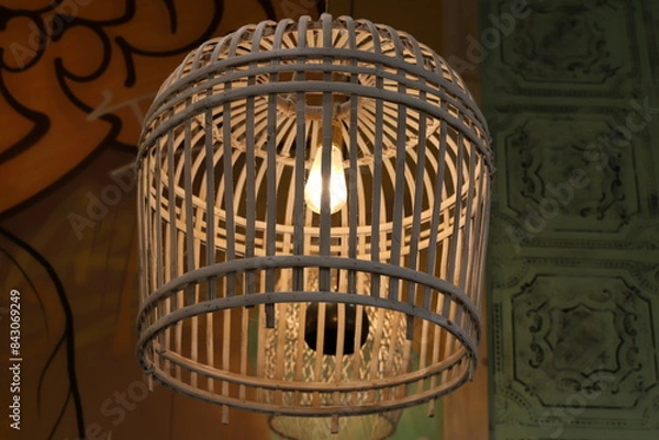 Fototapeta A lamp for illuminating the interior of the room hangs on the ceiling.