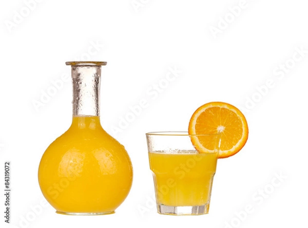 Fototapeta Orange juice in pitcher with orange. Isolated on white background