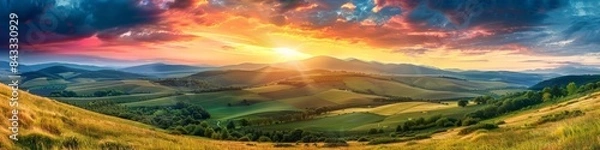 Fototapeta Panorama colorful magnificent sunset in countryside above hills and fields, beauty nature background