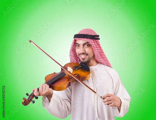 Fototapeta Arab man playing music on white
