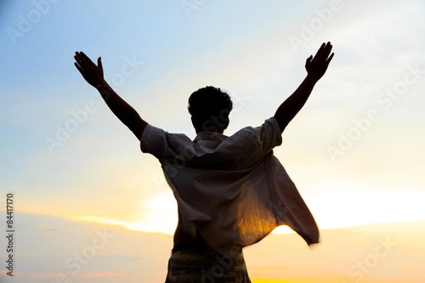 Obraz Stock Photo - silhouette of single man action at sunset.