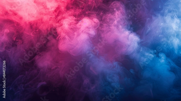 Fototapeta Colorful smoke curls from a hookah pipe on a dark background