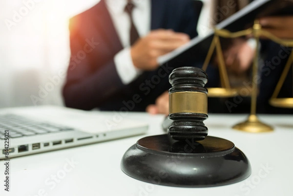 Obraz team meeting.businessman discussing legal legislation at law firm. judge gavel 