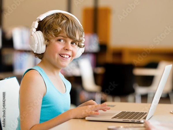 Fototapeta Boy spending time with notebook