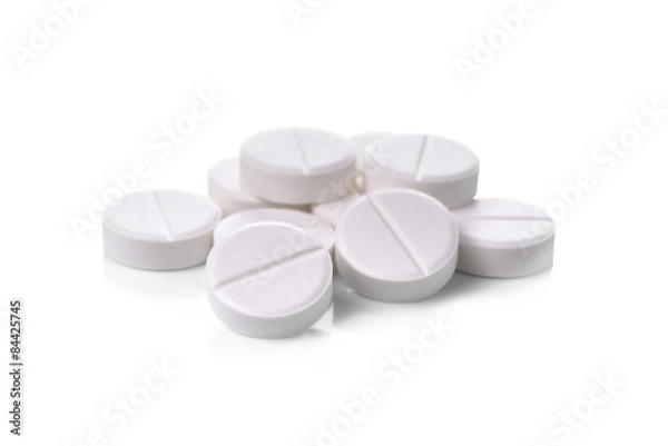 Obraz białe tabletki na białym tle