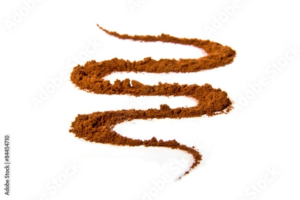 Fototapeta Cocoa powder scattered in a wave form
