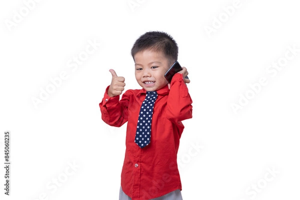 Obraz Adorable smiling little boy talking on smartphone and showing thumb it's good isolated on white background. Concept of communication and Mother's Day love family lifestyle. Copy space