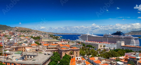 Fototapeta Luxury cruise ship is docked in the port of Messina.
