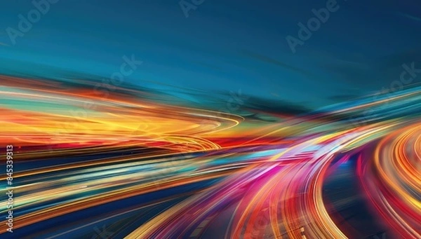 Fototapeta The highway comes to life in a blur of motion and light as cars streak past leaving behind a mesmerizing trail of vibrant colors.
