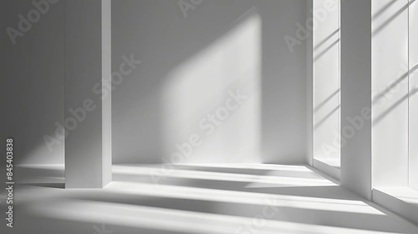 Obraz A gray background for product presentation, featuring shadows and light streaming in from windows.