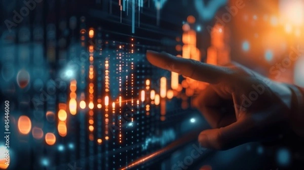 Fototapeta Close up of hand pointing at glowing business chart. Stock, market and trade concept. Can be used for advertising, marketing or presentation.