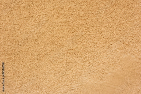 Fototapeta Soil wall texture of clay house structure. building from mud. soft picture