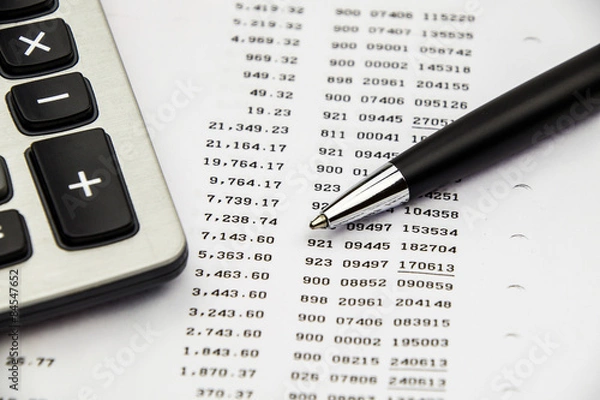 Fototapeta Bank statement with calculator and pen