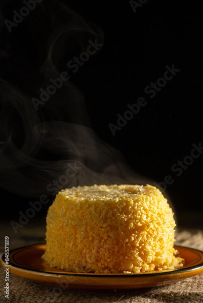 Fototapeta Dish of couscous "cuscuz brasil" "Cuscus,Cuzcuz,Cuscuz" individual portion, mini traditionally from the north and northeast of Brazil, typical food of Brazilian cuisine, on a rustic wooden table