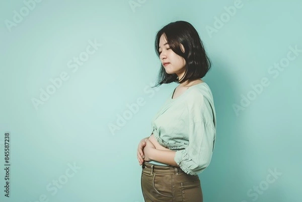 Obraz 痩せたいのにダイエットに失敗してまた太ったことに悩む肥満女性
