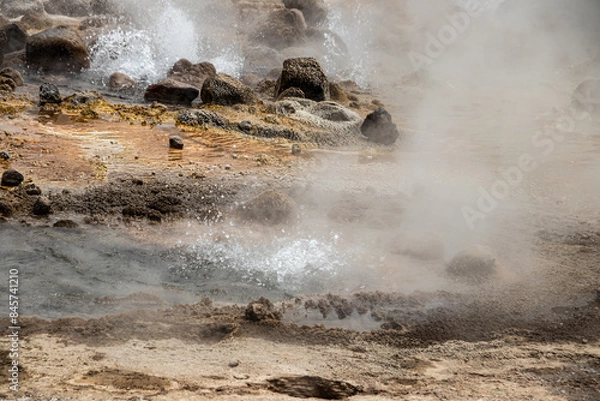 Fototapeta Alolabad geothermal area in Ethiopia with surreal landscape of colorful hot springs, steaming fumaroles, and erupting salt geysers in an arid, remote desert setting below sea level, Afar desert
