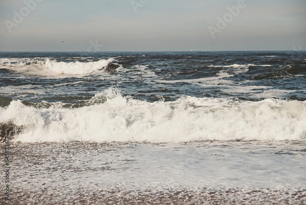 Fototapeta ocean waves by the beach