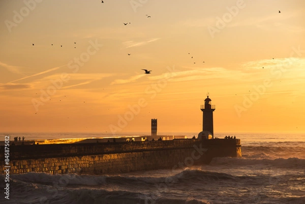 Obraz Sunset in the ocean by the lighthouse