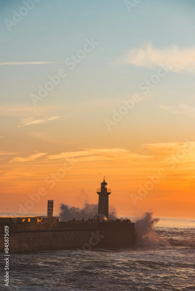 Obraz Sunset in the ocean by the lighthouse