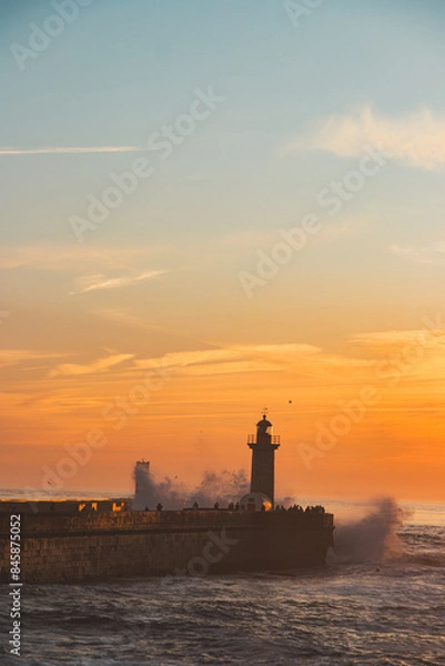 Obraz Sunset in the ocean by the lighthouse