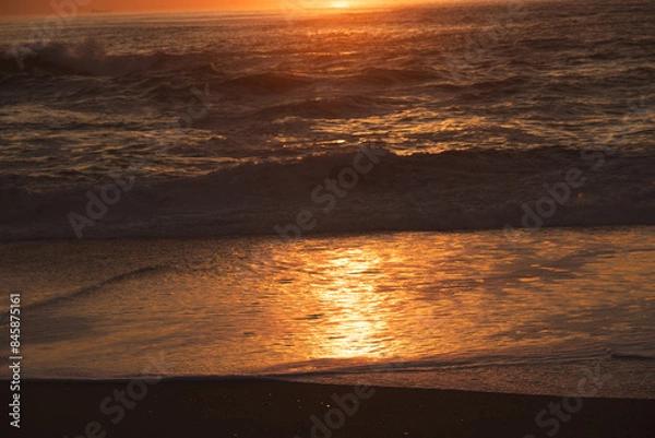Obraz Sunset in the ocean by the lighthouse