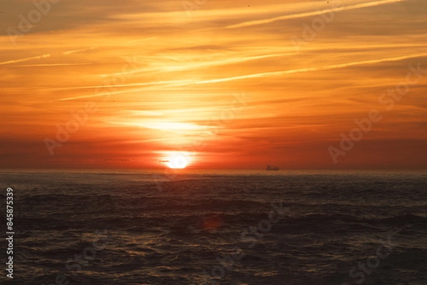 Obraz Sunset in the ocean by the lighthouse