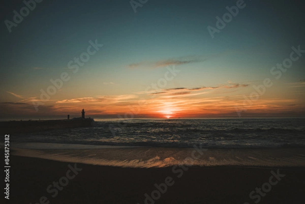 Obraz Sunset in the ocean by the lighthouse