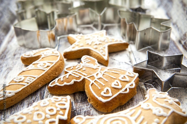 Obraz Christmas gingerbread cookies and metal cookie cutters on white