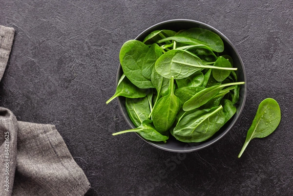 Obraz Fresh green spinach leaves in the bowl. Natural vegetarian food.