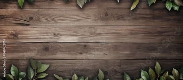 Fototapeta A wallpaper design featuring leaves and wood elements with plenty of empty space for a copy space image