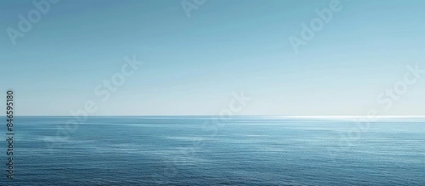 Obraz Vast blue ocean and a cloudless sky with room for text.